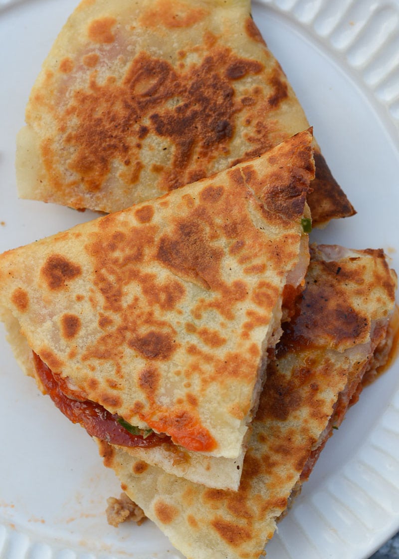 This Supreme Pizza Quesadilla is loaded with all your favorite classic pizza toppings! A low-carb tortilla keeps this recipe perfect for a pizza craving while on keto!