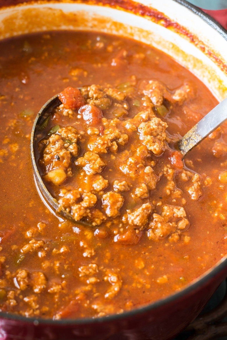 This hearty Keto Chili recipe features tons of meat, peppers, spices and tomatoes! At about 8 net carbs per serving this low carb, no bean chili will become a family favorite!