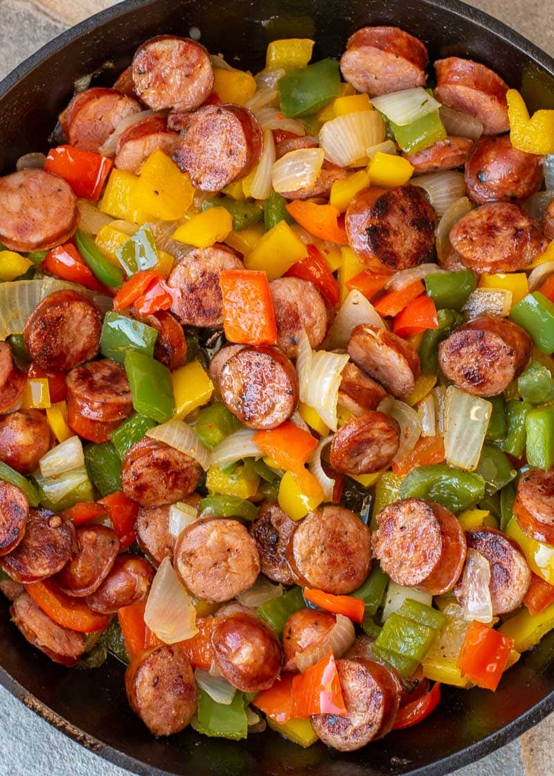 This one pan Sausage and Peppers recipe is perfect for a weeknight meal! Healthy, ready in 15 minutes, 3 ingredients, and under 8 net carbs per serving.