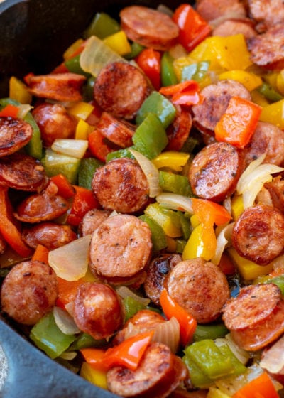 This one pan Sausage and Peppers recipe is perfect for a weeknight meal! Healthy, ready in 15 minutes, 3 ingredients, and under 8 net carbs per serving.