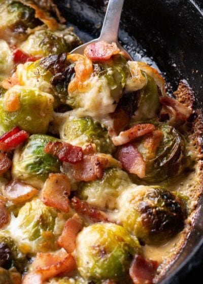 These Cheesy Brussels Sprouts with Bacon are made in one pan and perfect for entertaining! This easy vegetable side dish is low carb and keto-friendly! 