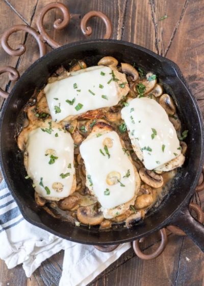 This One-Pan Keto Chicken and Mushroom Skillet is covered in Swiss cheese and swimming in a creamy mushroom sauce! This easy dinner is ready in under 30 minutes and has just 2 net carbs per serving!