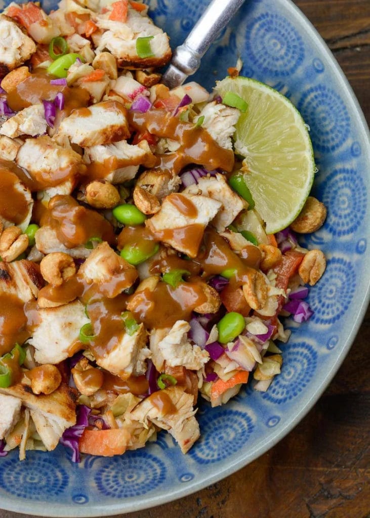 This Crunchy Thai Chicken Salad features fresh cabbage, carrots and bell pepper, all topped with a creamy peanut dressing! This easy recipe is a great way to use up leftover chicken or veggies and is perfect for meal prep!