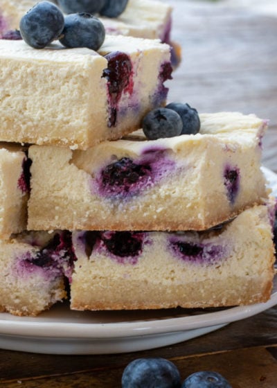 These easy Blueberry Cheesecake Bars are the perfect keto dessert! Each serving is under 3 net carbs and bursting with flavor for a treat you won't even realize is sugar free!