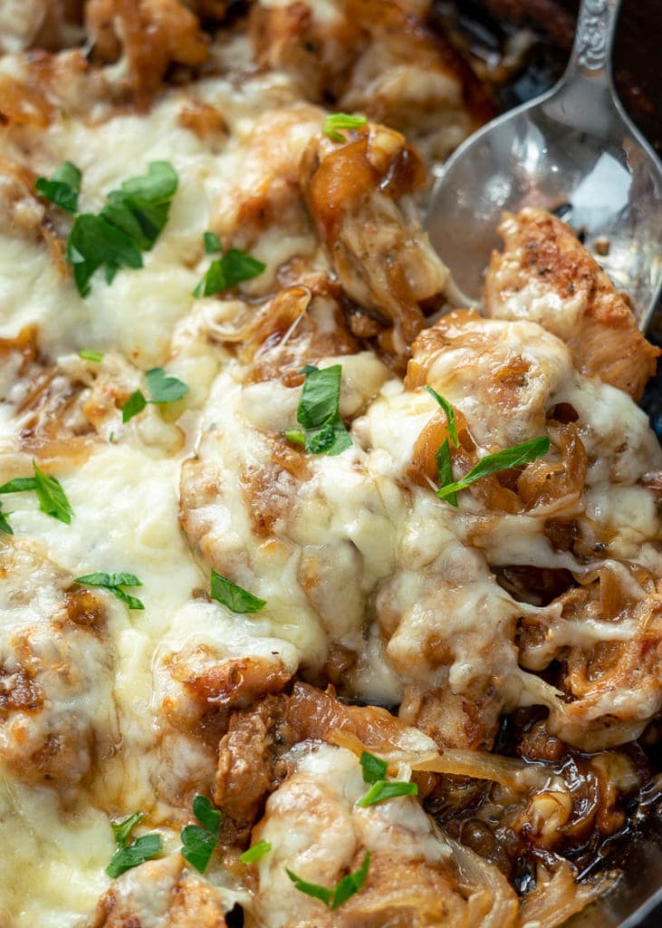 This easy French Onion Chicken has the rich, deep flavor you find in French Onion Soup but in an easy skillet meal! Herb crusted chicken is pan seared and simmered in a caramelized onion sauce and smothered with creamy Gruyere! 