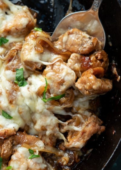 This easy French Onion Chicken has the rich, deep flavor you find in French Onion Soup but in an easy skillet meal! Herb crusted chicken is pan seared and simmered in a caramelized onion sauce and smothered with creamy Gruyere!