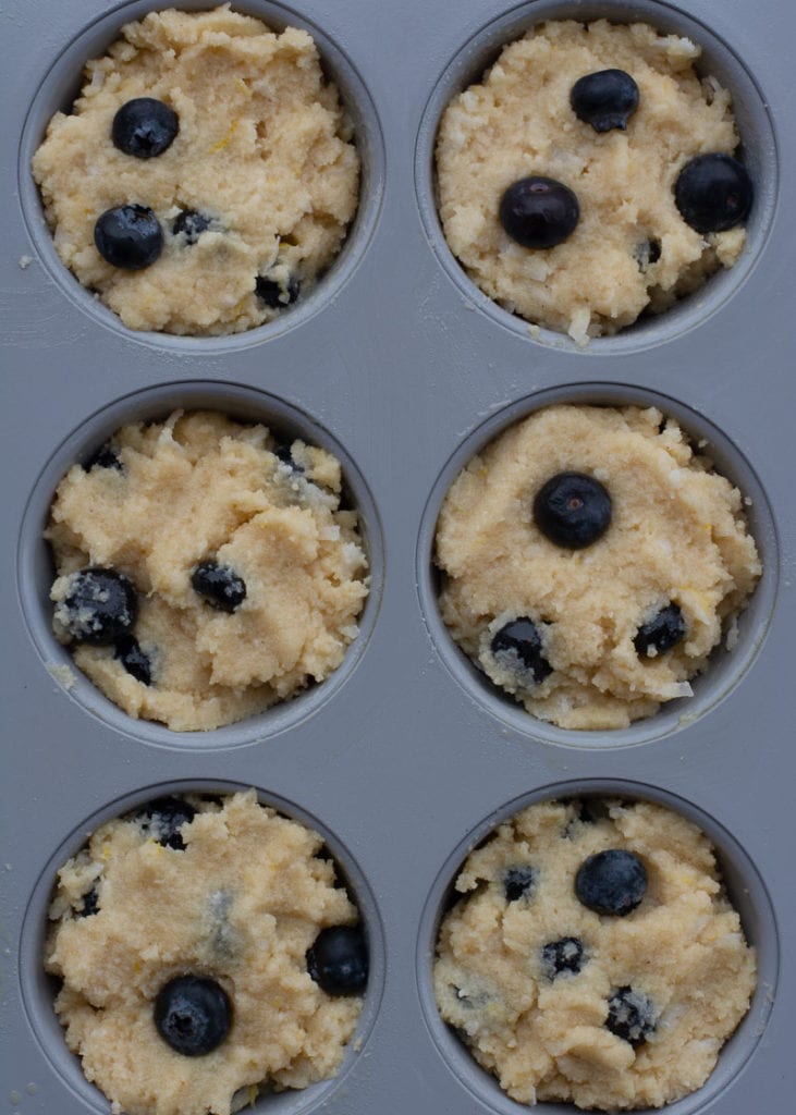 These Easy Keto Blueberry Muffins are the perfect way to start the day! Large fluffy coconut flour muffins are packed with blueberries for about 4 net carbs each. 