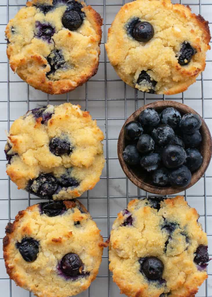These Easy Keto Blueberry Muffins are the perfect way to start the day! Large fluffy coconut flour muffins are packed with blueberries for about 4 net carbs each. 