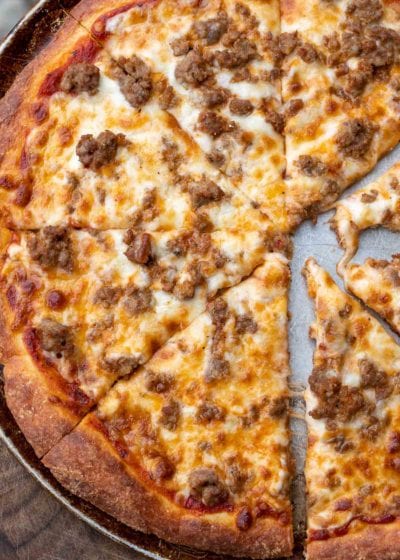 Follow this step by step guide to make the BEST Keto Pizza Crust Recipe! This crust is made from a fat head dough base and is low carb, grain and gluten free!