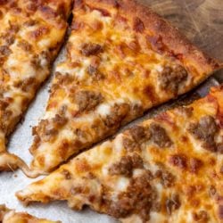 This step-by-step guide will show you exactly how to make the best Keto Pizza Recipe! This low carb pizza crust is crispy and delicious! Enjoy a slice of this keto pizza for about 3 net carbs!