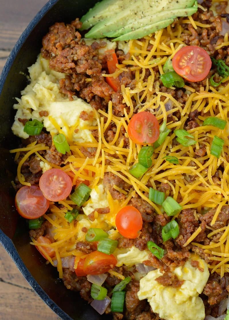 This hearty Chorizo Breakfast Scramble is the ultimate low carb, keto-friendly breakfast! Each generous serving has just 5 net carbs and is loaded with spicy chorizo, peppers, onions, eggs and cheese!