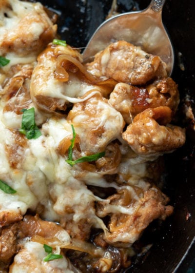 This easy French Onion Chicken has the rich, deep flavor you find in French Onion Soup but in an easy skillet meal! Herb crusted chicken is pan seared and simmered in a caramelized onion sauce and smothered with creamy Gruyere!