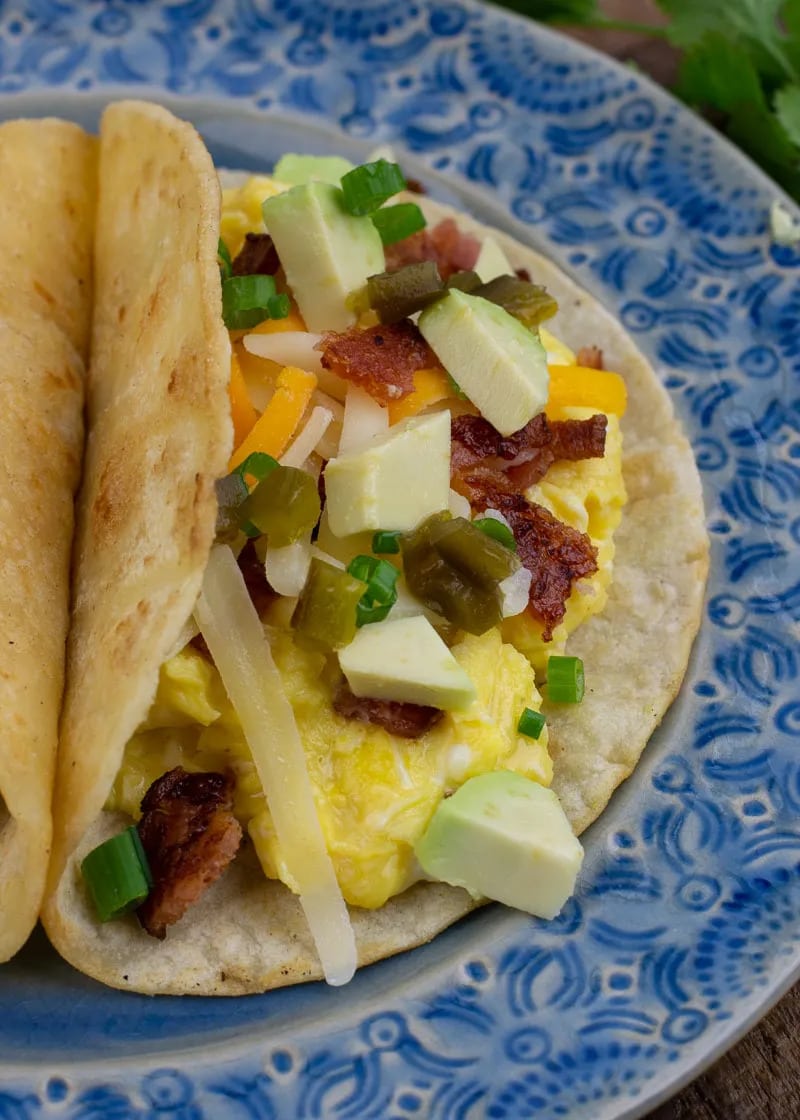 These Bacon Breakfast Tacos are simple, delicious, and super filling! Crunchy bacon, fluffy eggs, and creamy avocado make the best breakfast recipe.
