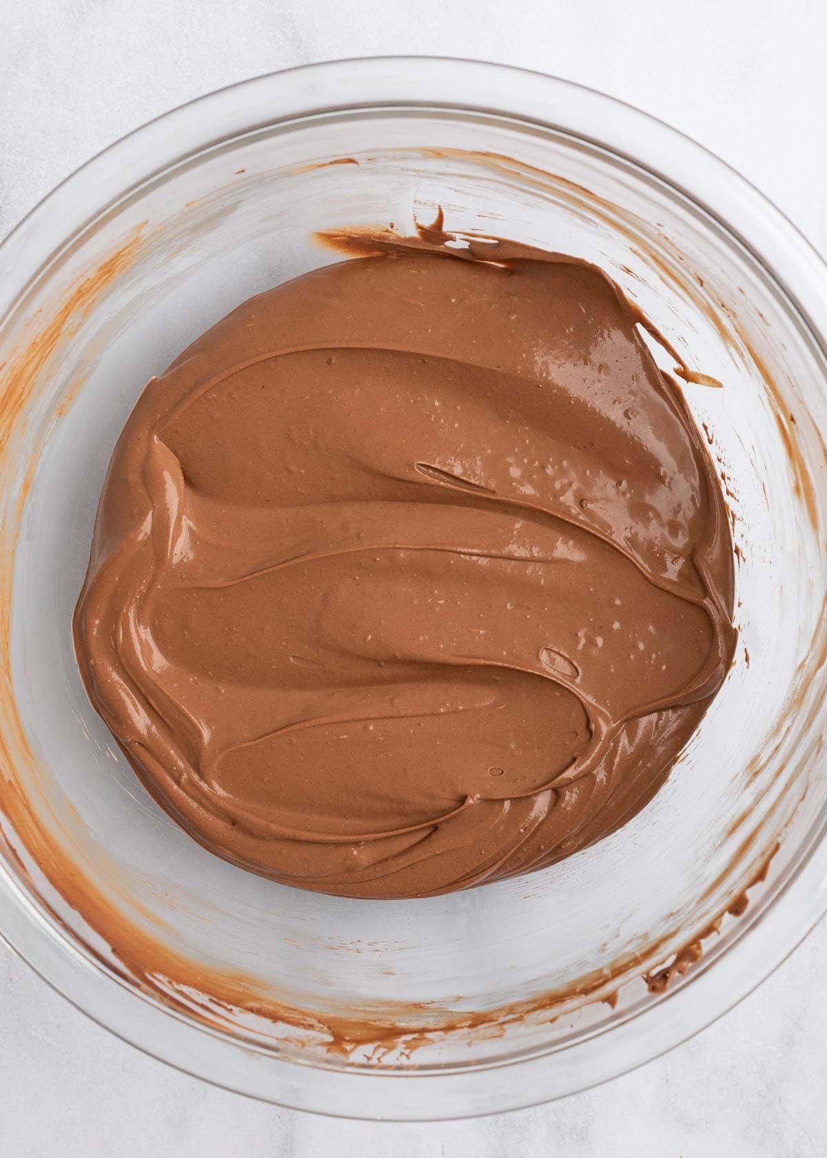 A bowl of chocolate frosting
