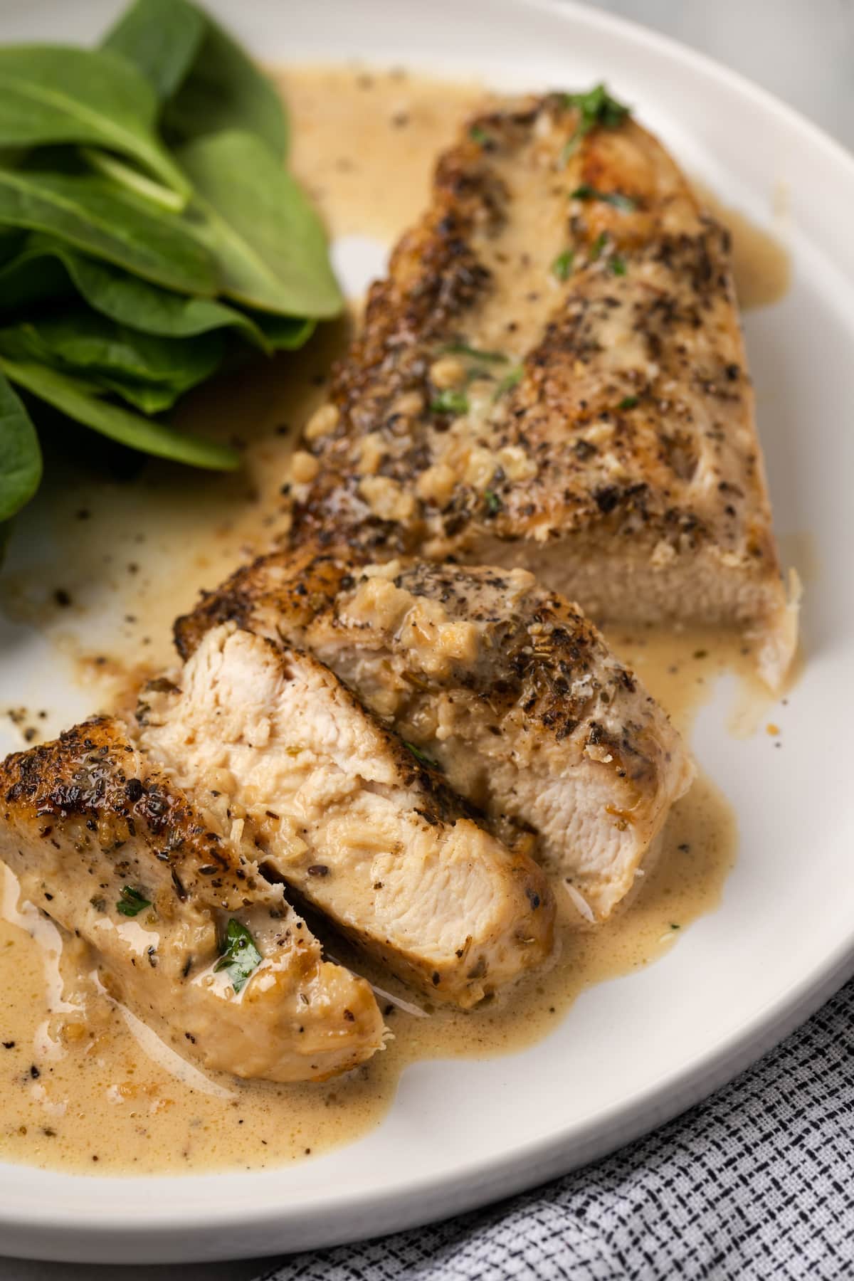 This garlic parmesan chicken recipe is rich, creamy, and loaded with garlic. It’s a decadent keto-friendly dinner that you can make at home in about 20 minutes.