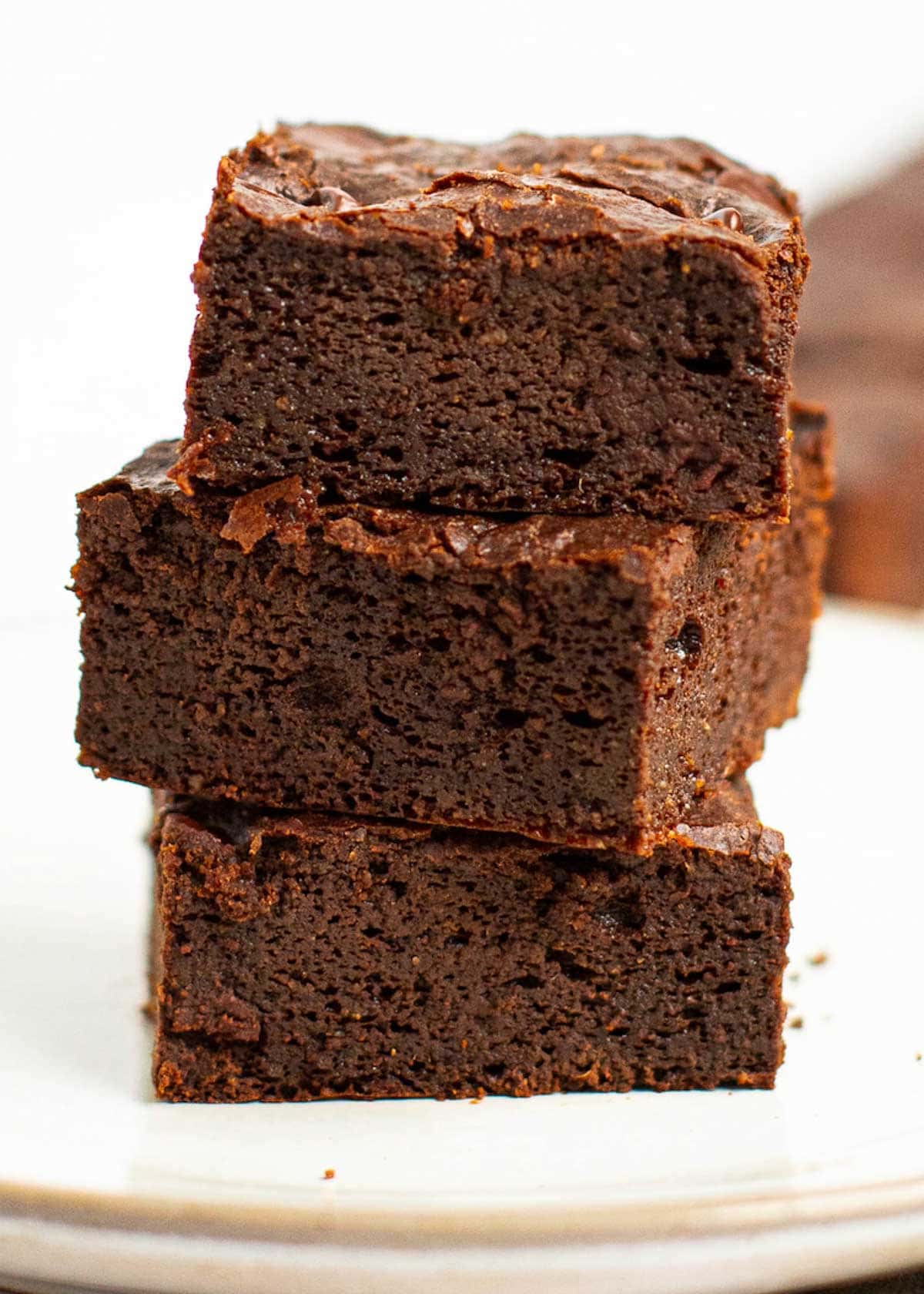 Close up of three brownie squares stacked on each other