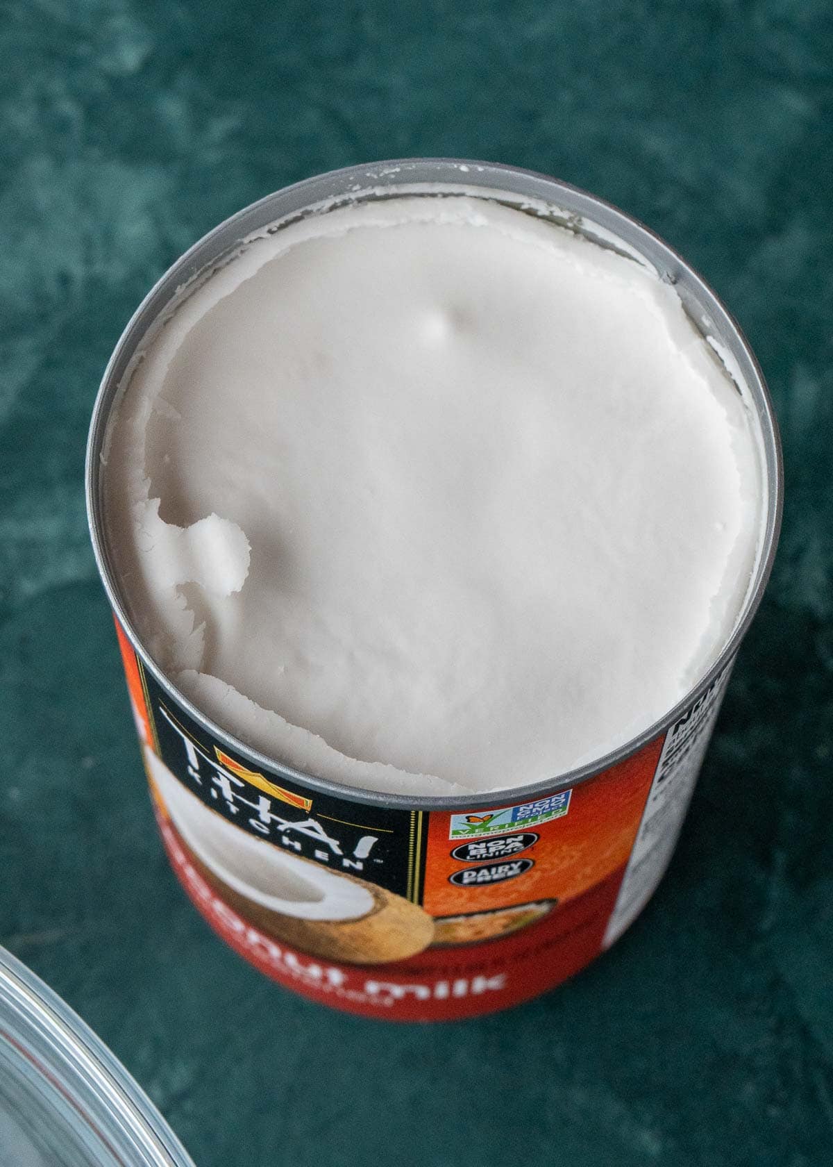 Overhead view of an opened can of coconut milk