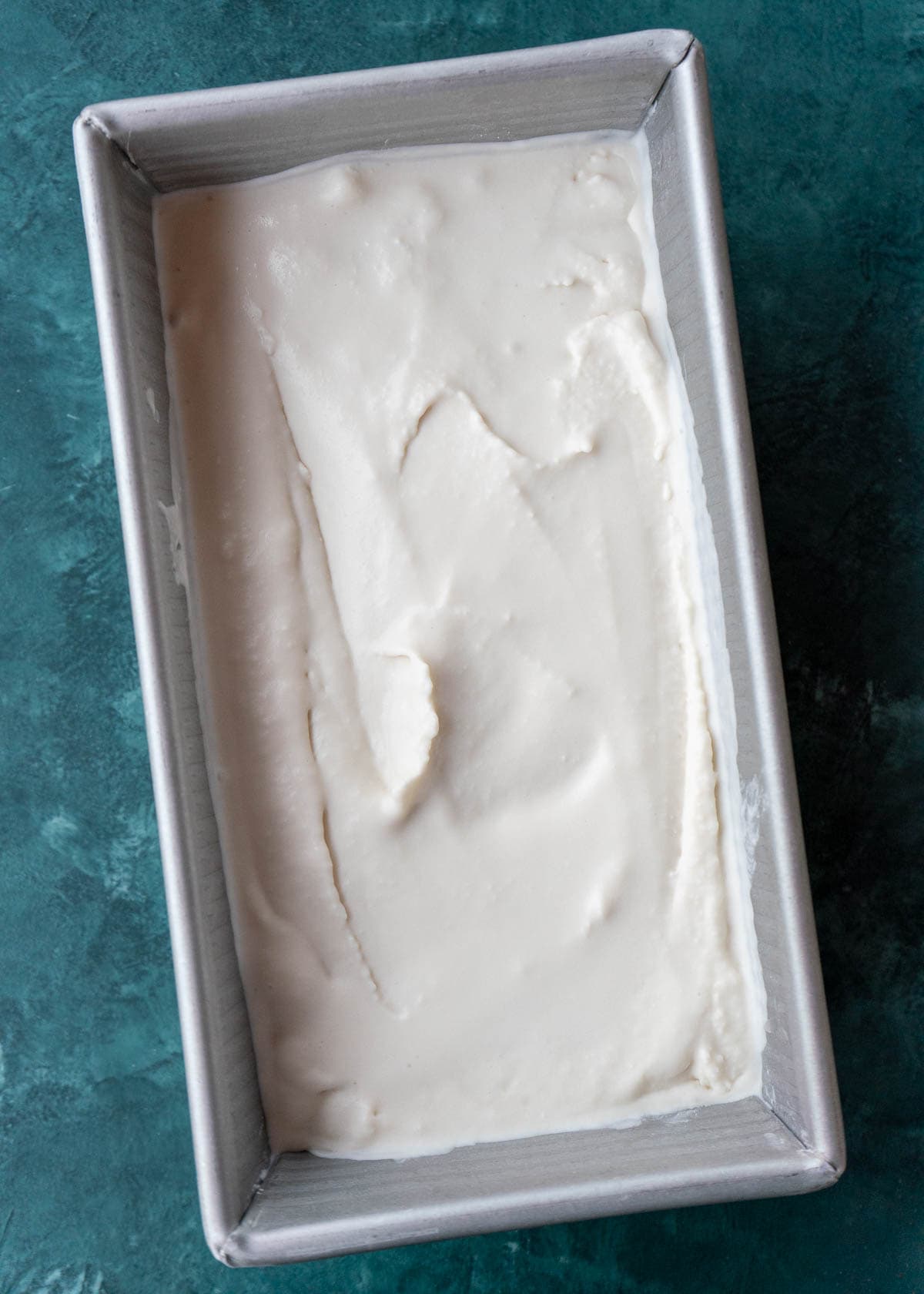 Unfrozen ice cream in a loaf pan