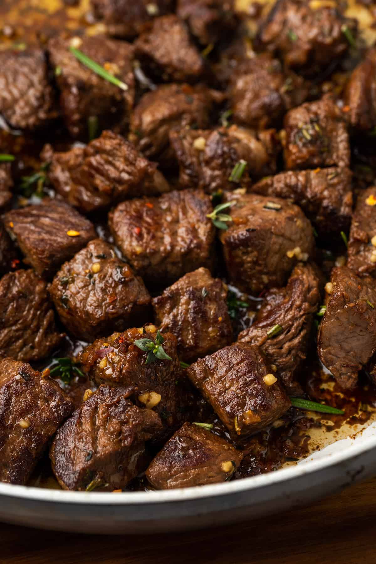 These easy Garlic Butter Steak Bites are cooked in a sauce with fresh herbs, chili flakes, and garlic. This steak recipe is naturally low-carb, requires one pan, and takes just 15 minutes to make.