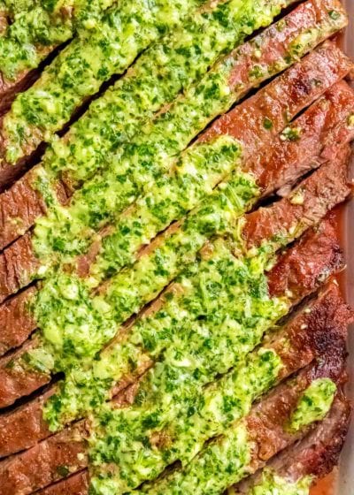 grilled flank steak with chimichurri on top