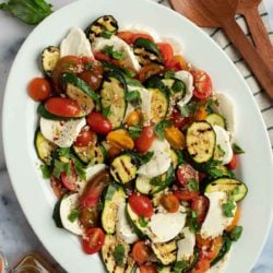 This Grilled Zucchini Salad with a homemade red wine vinaigrette will be your repeat meal of the summer! This healthy recipe is ready in under 30 minutes, loaded with fresh mozzarella and tender veggies, and has fewer than 5 net carbs.