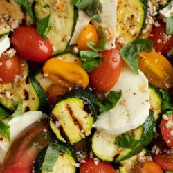 This Grilled Zucchini Salad with a homemade red wine vinaigrette will be your repeat meal of the summer! This healthy recipe is ready in under 30 minutes and loaded with fresh mozzarella and tender veggies.
