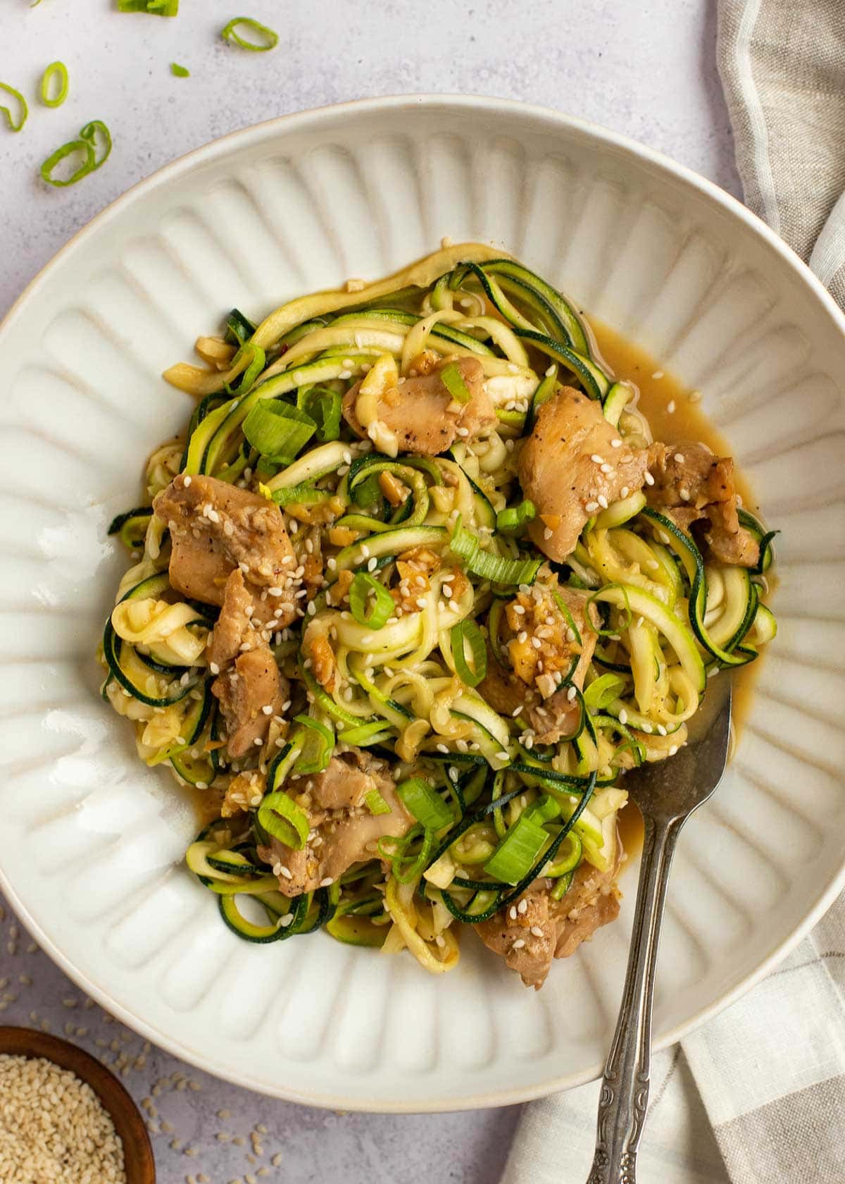 asian chicken and zucchini on plate