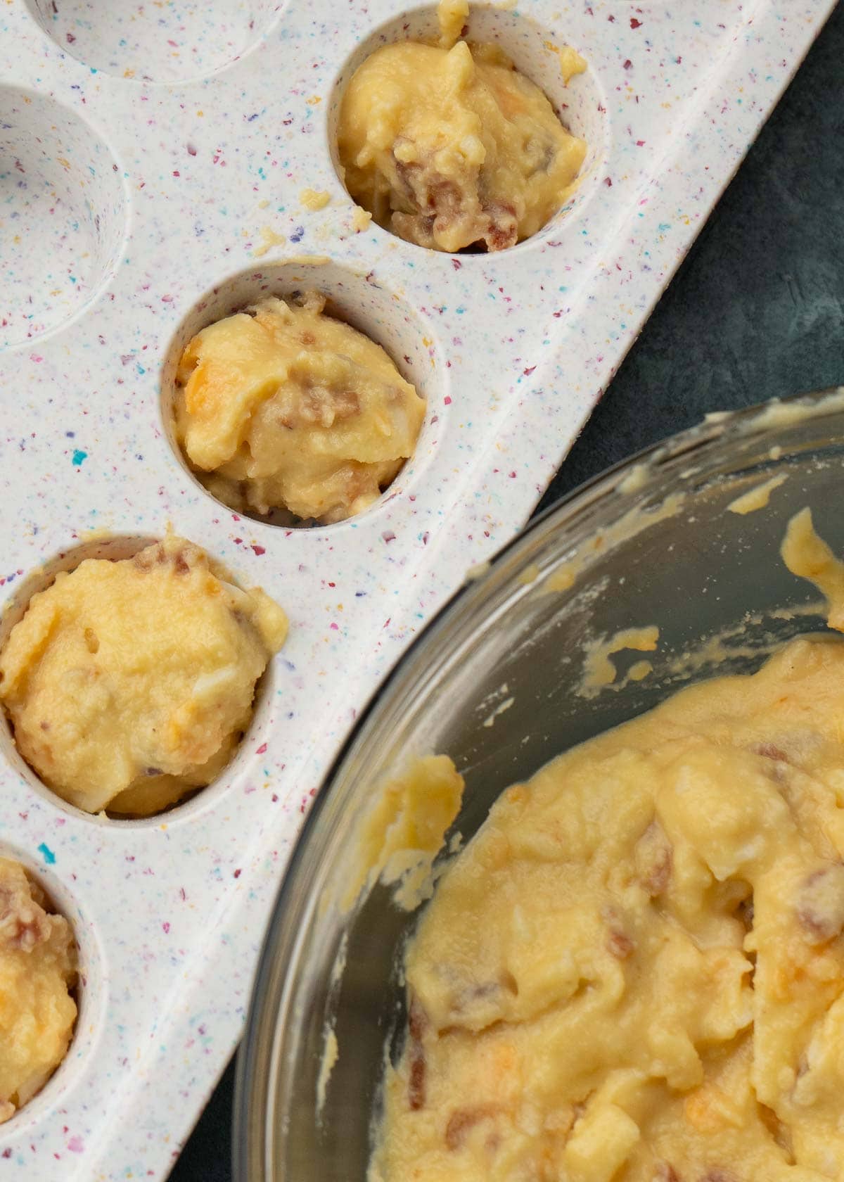 bacon egg and cheese muffins in a muffin pan