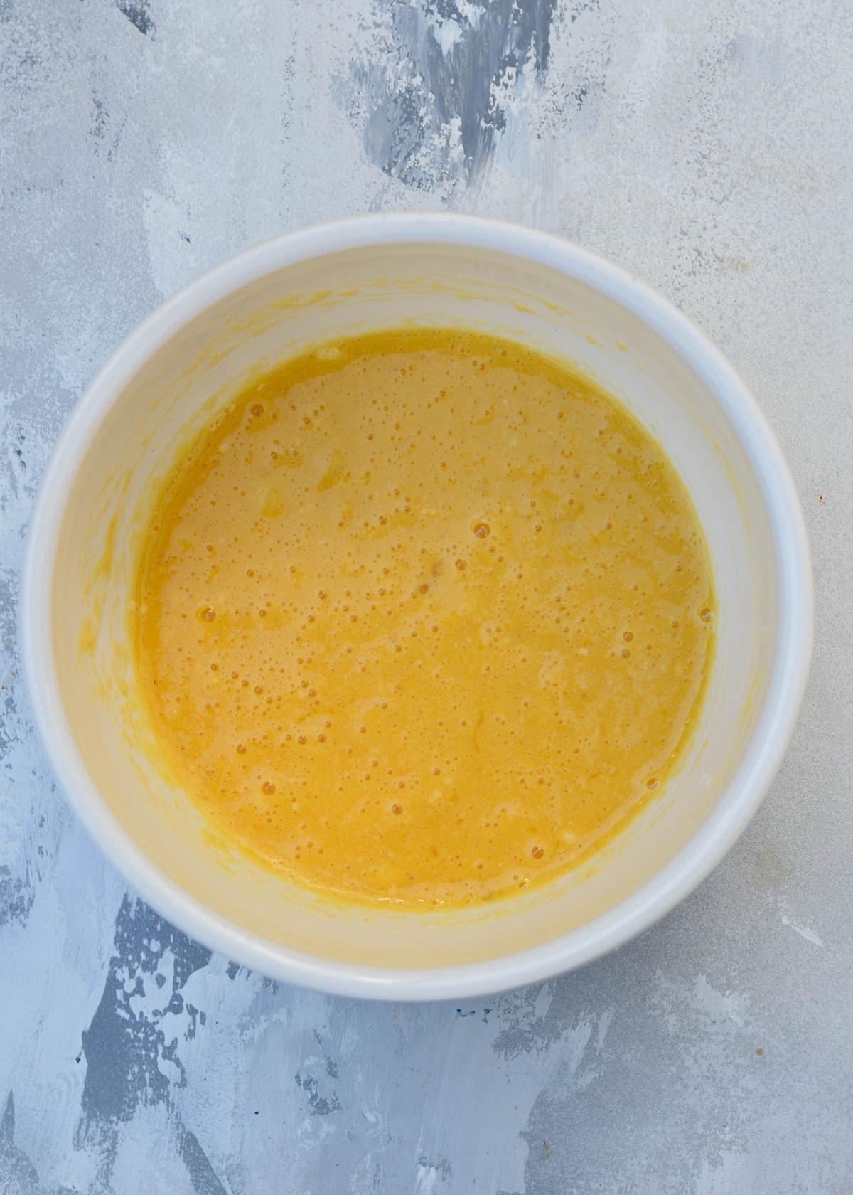 dry ingredients mixed with eggs in mixing bowl