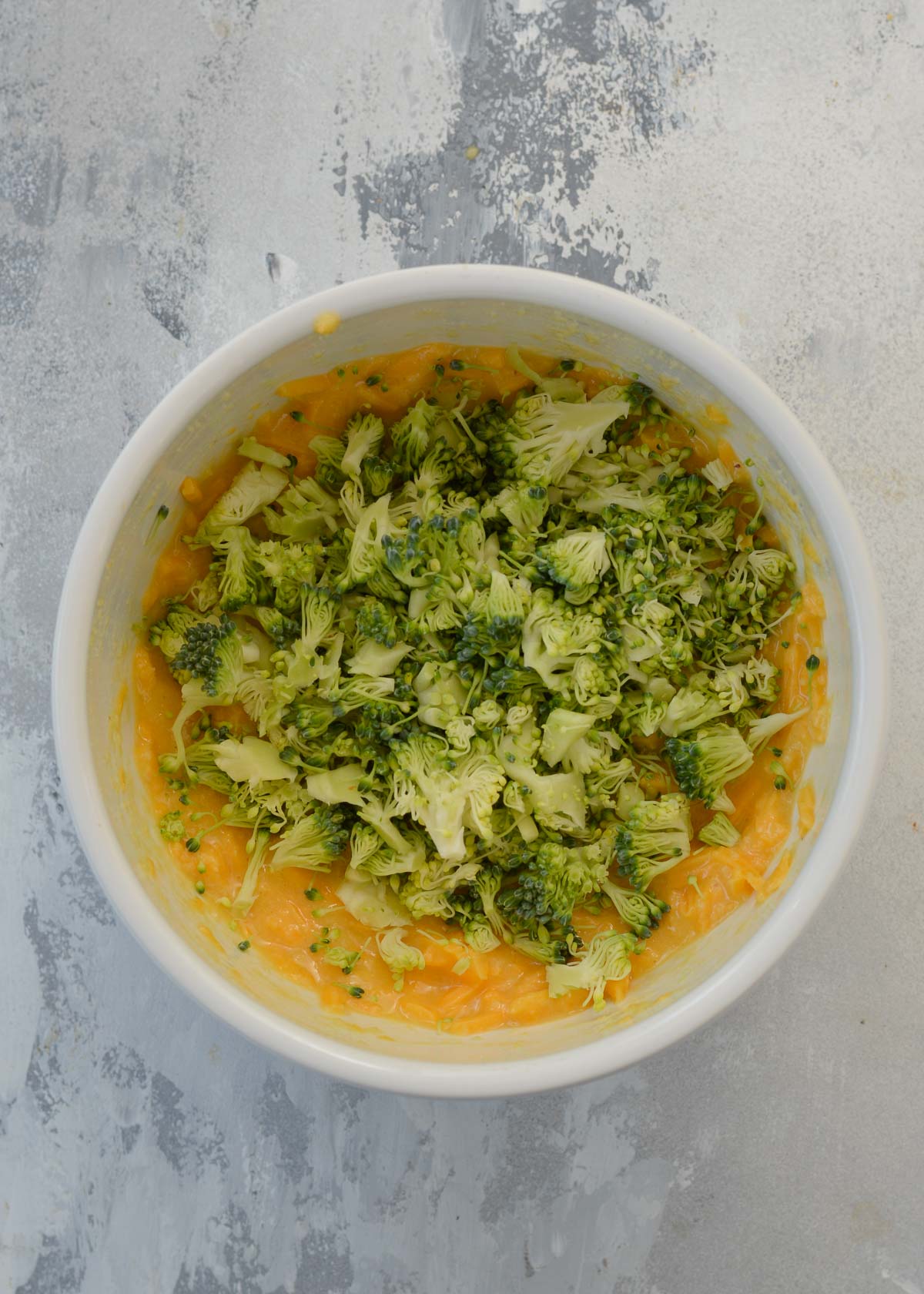 broccoli being added to batter