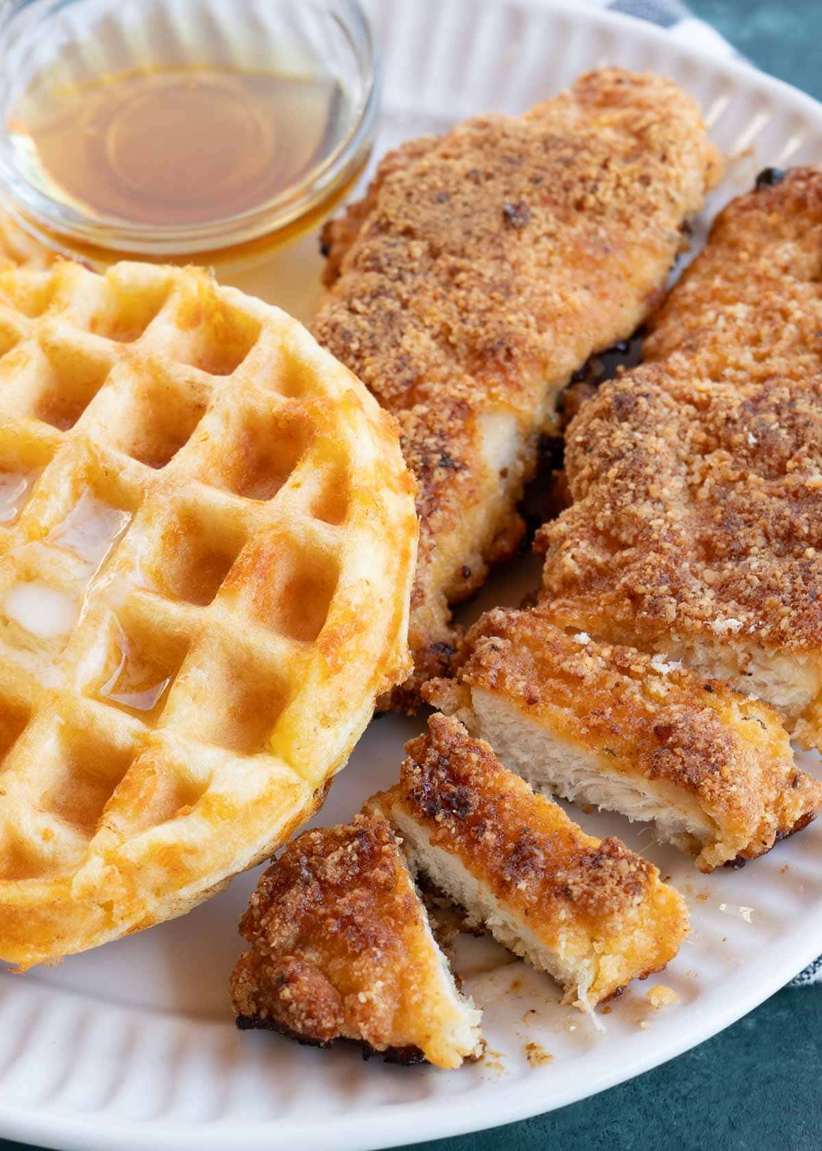 chicken and waffles on white plate