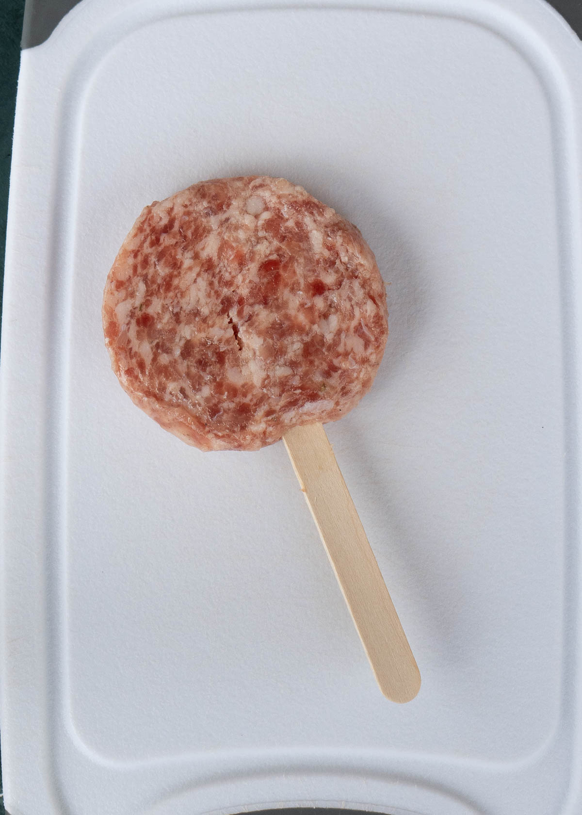 sausage patty in a Popsicle stick