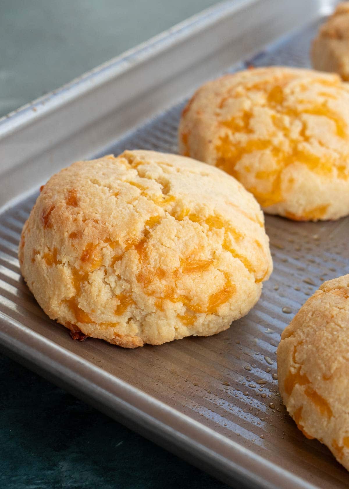cooked biscuits on a baking sheet