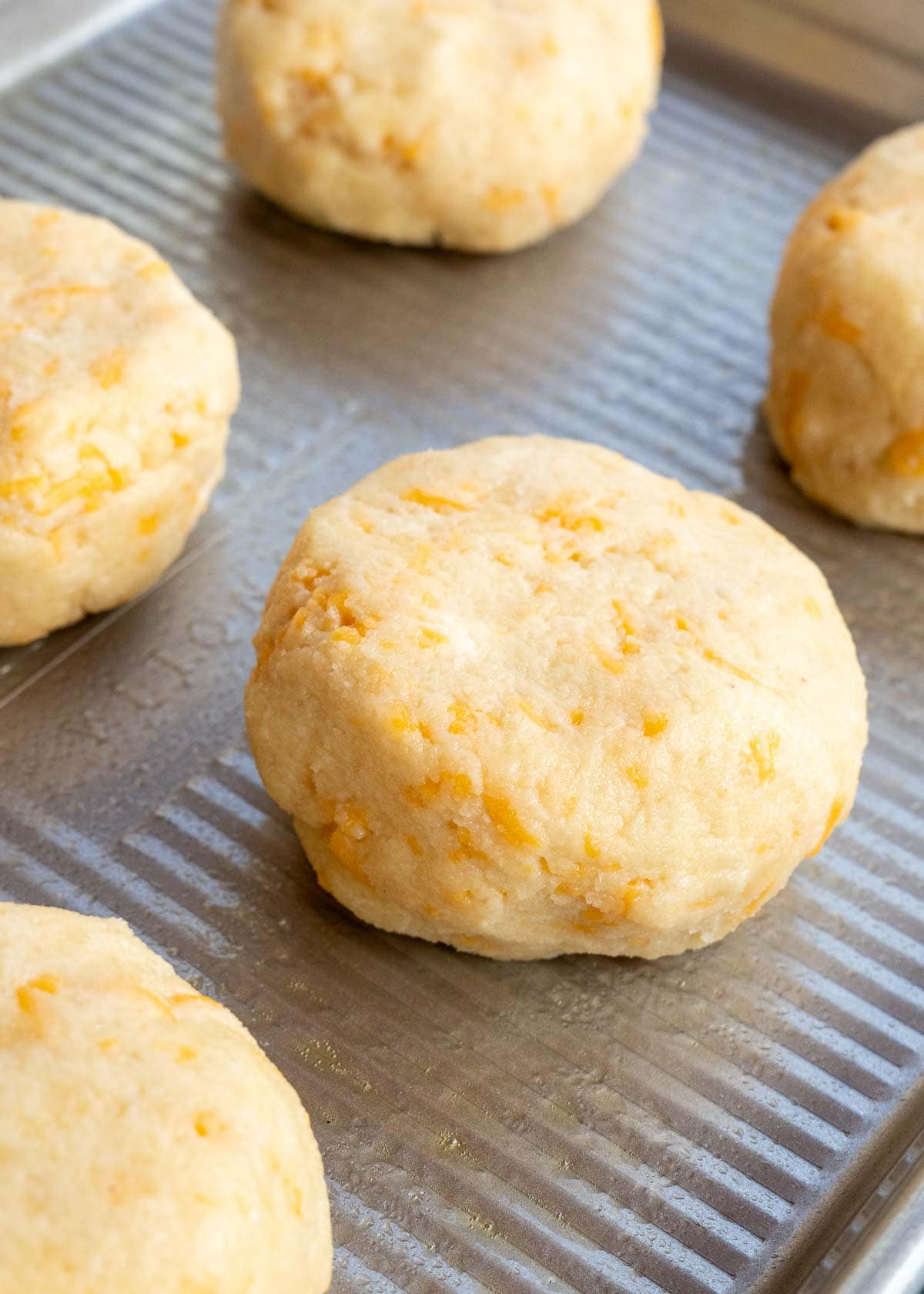 biscuit dough on a baking sheet