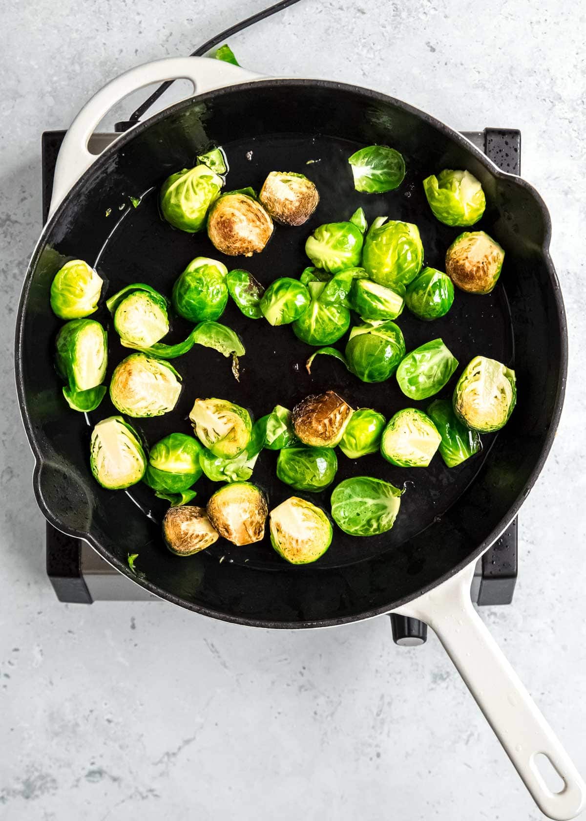 brussels cooking in a pan, flat sides seared