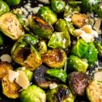 balsamic glazed brussels sprouts in a skillet with parmesan cheese