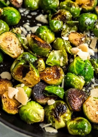 balsamic glazed brussels sprouts in a skillet with parmesan cheese