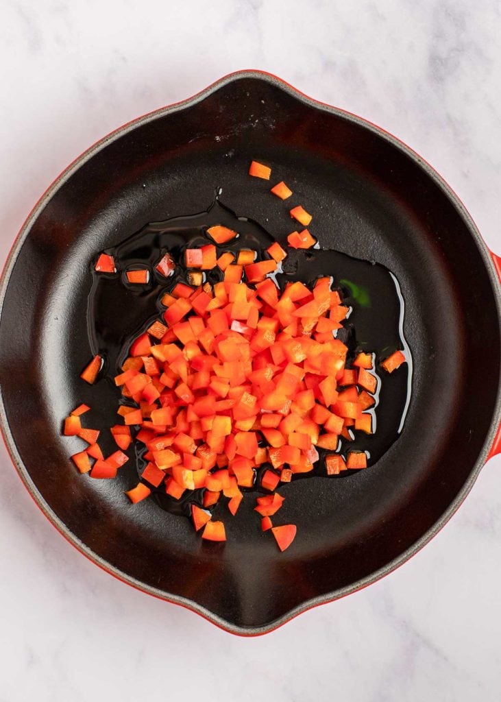 diced red pepper in a skillet