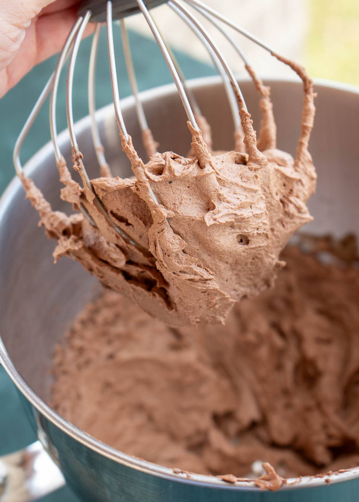 a beater with whipped chocolate ganache frosting