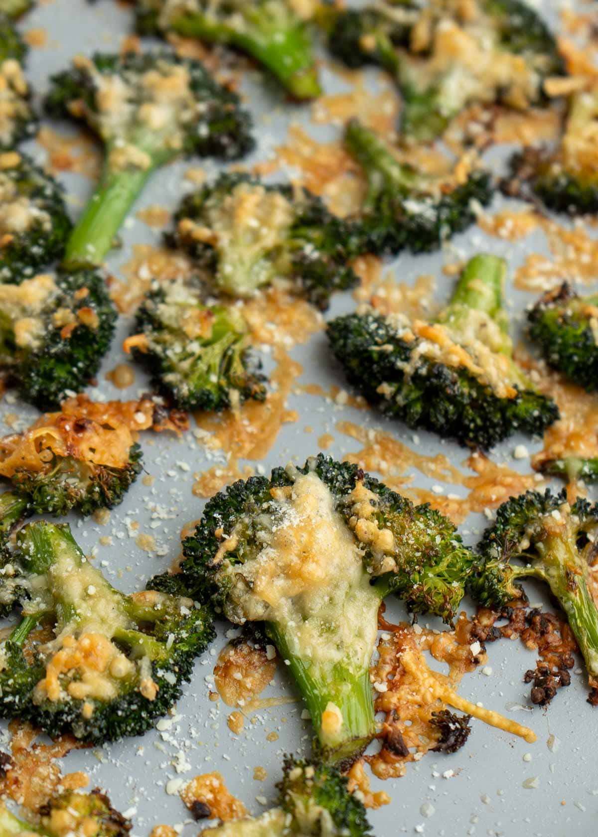cheesy smashed broccoli on a baking sheet