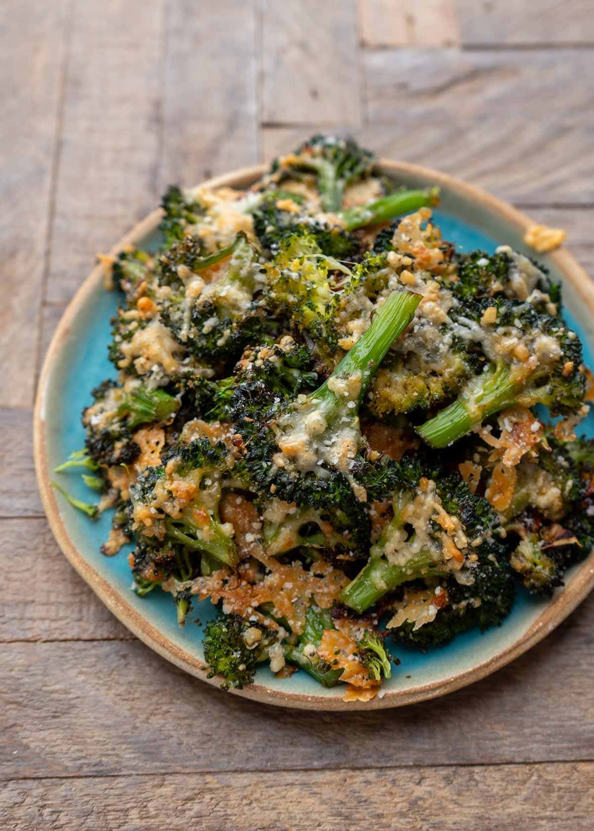 far-away shot of plate full of smashed broccoli