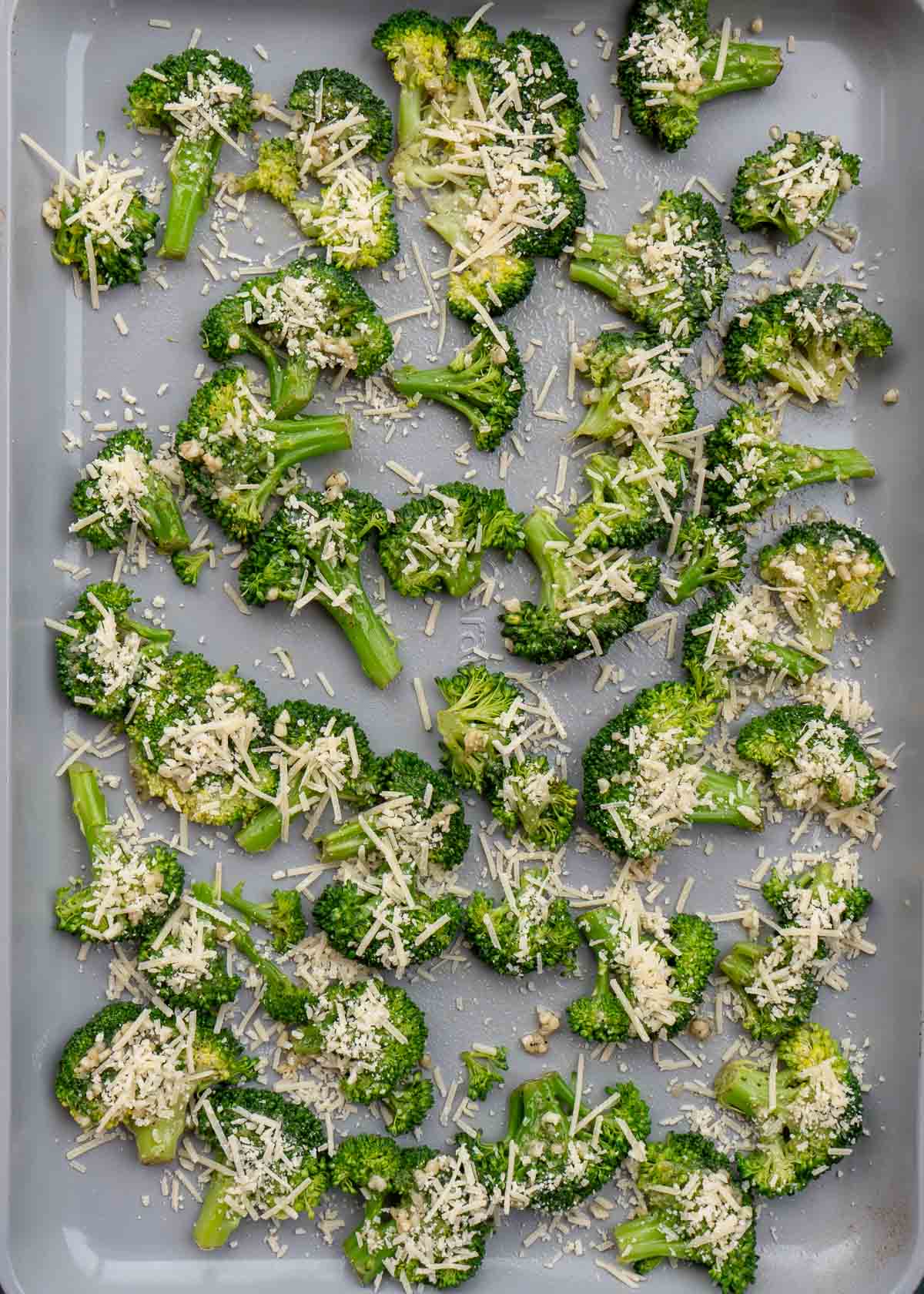smashed broccoli covered with shredded cheese