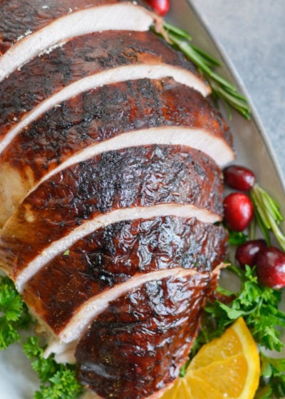 This Smoked Whole Turkey recipe is stuffed and coated in a homemade spice rub, then slow smoked to tender and juicy perfection. Learn how to Smoke a Whole Turkey in this easy tutorial!