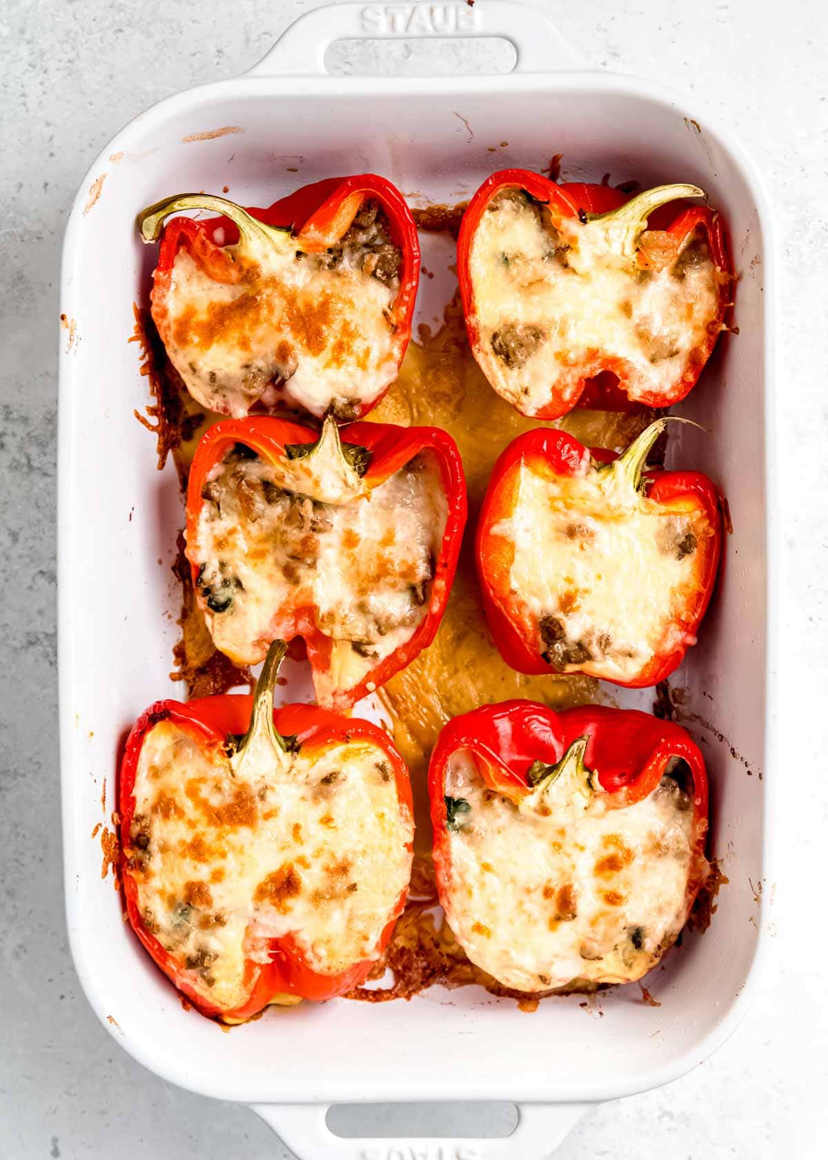 cooked breakfast stuffed bell peppers in baking dish