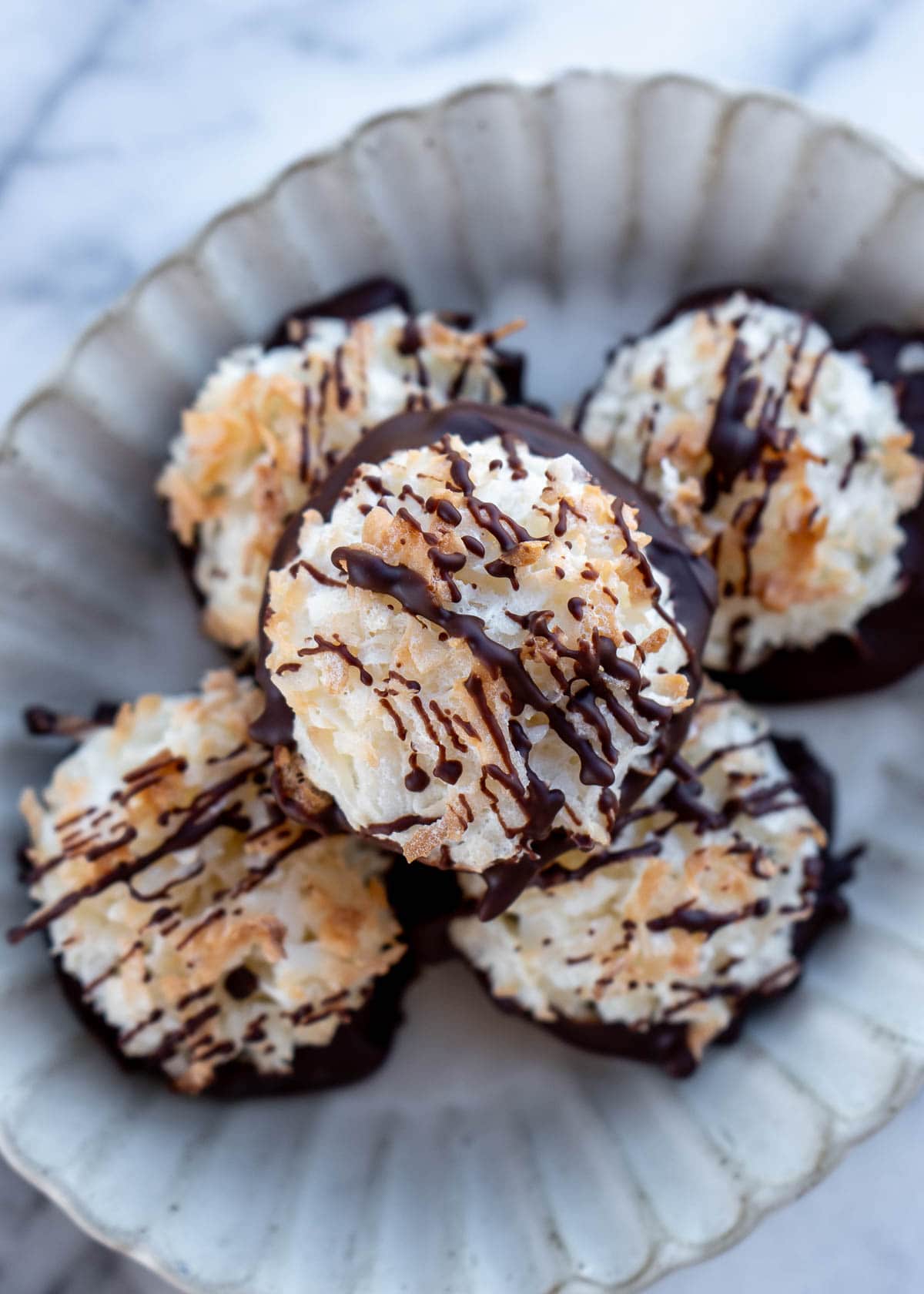 an overhead shot of chocolate drizzled macaroons