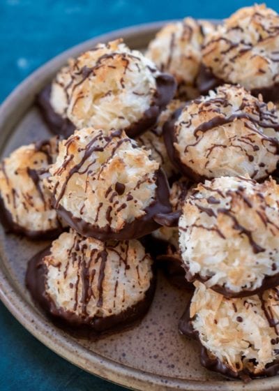 a plateful of chocolate drizzled macaroons