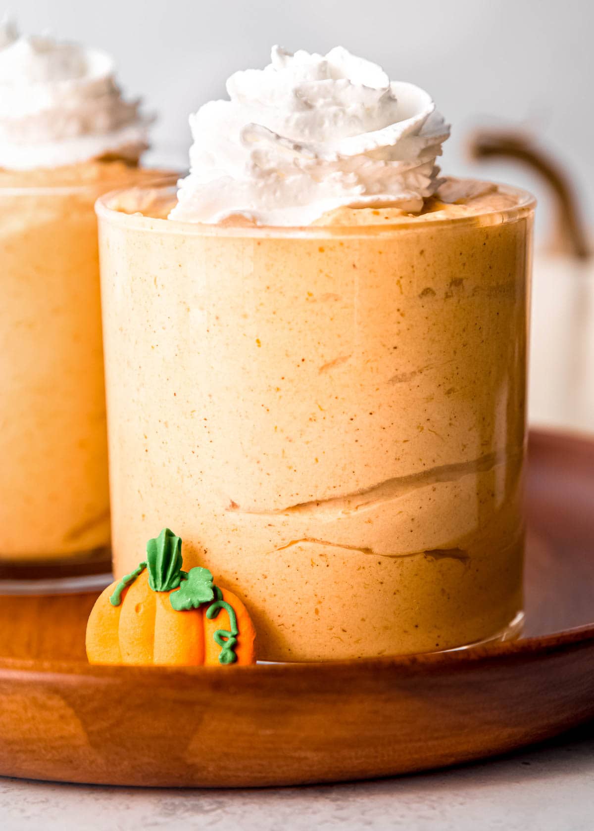 pumpkin mousse topped with pumpkin pie spice and whipped cream