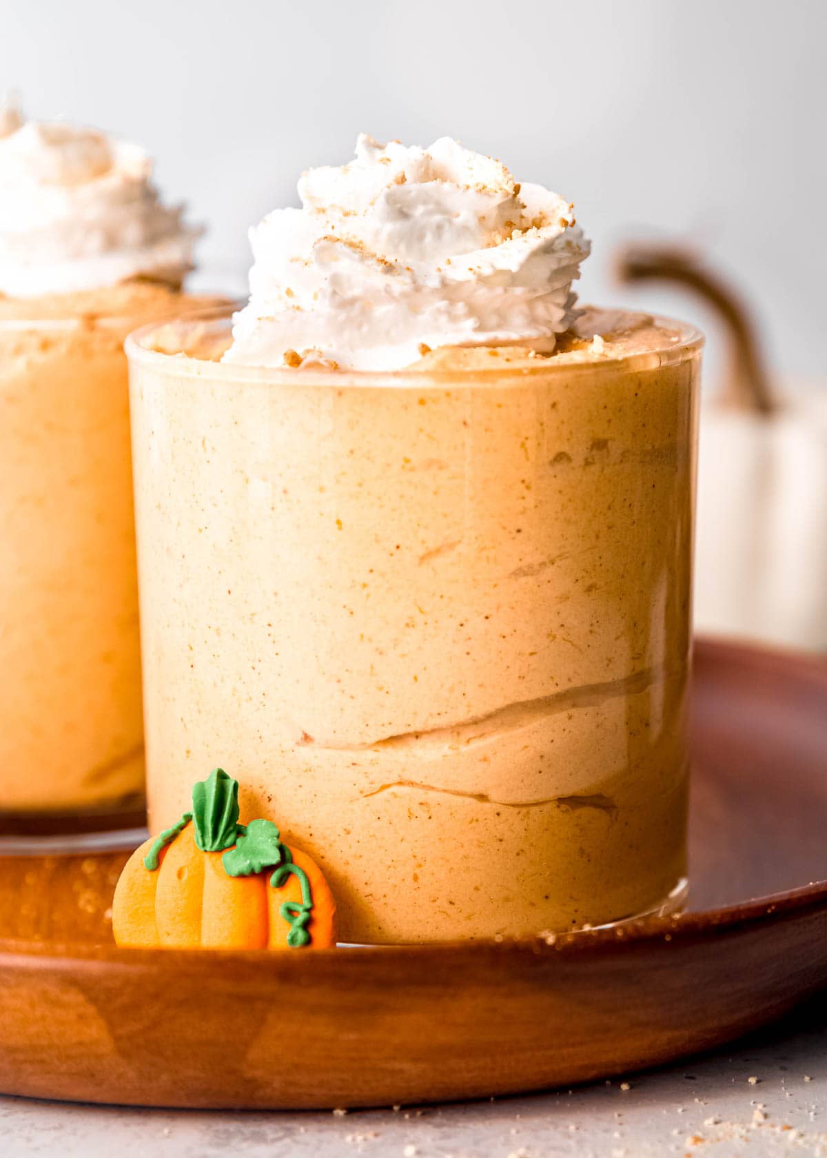 easy pumpkin mousse in a jar, topped with whipped cream