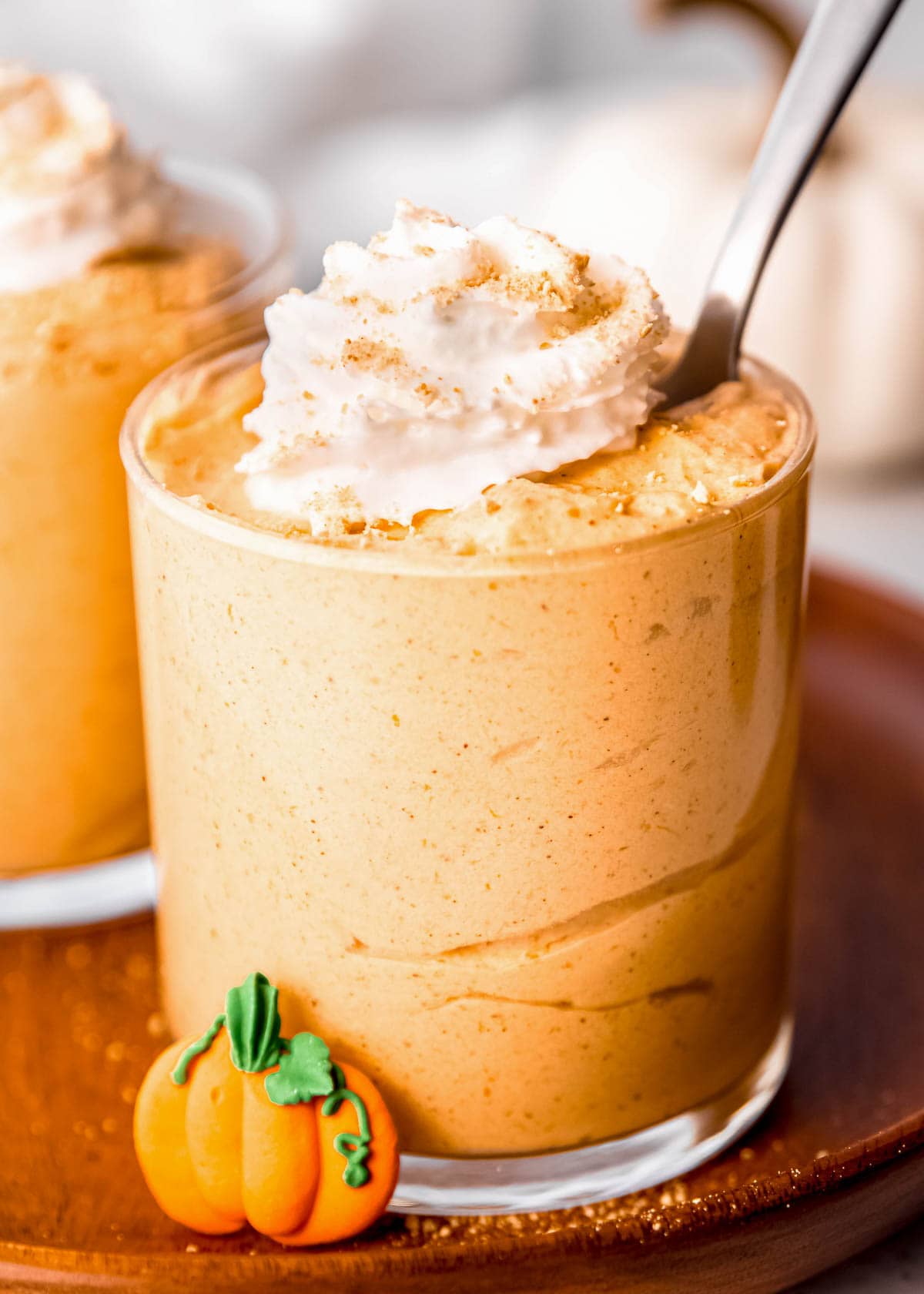 spoon in a cup full of easy pumpkin mousse