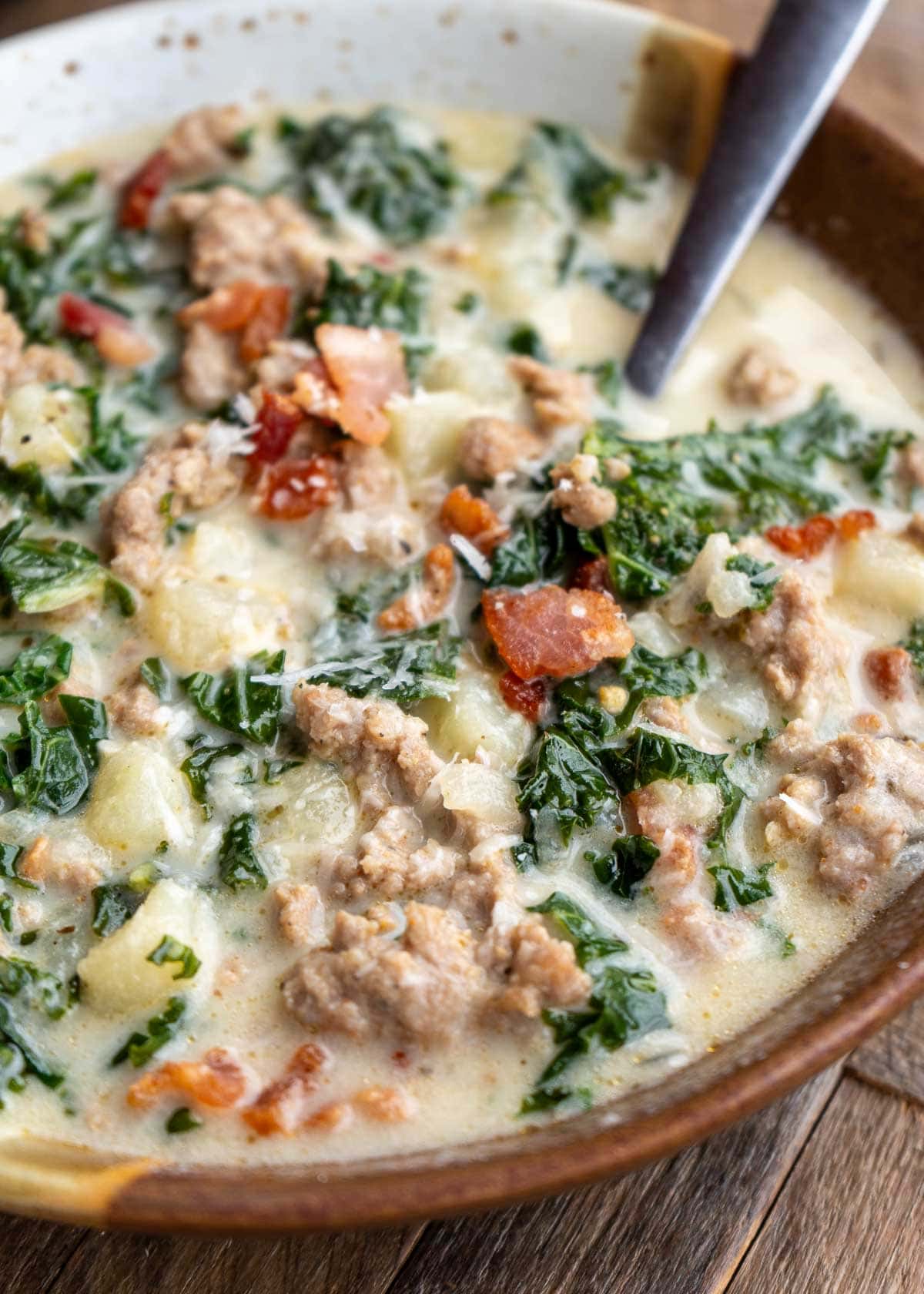 a side angle of zuppa toscana soup in a bowl